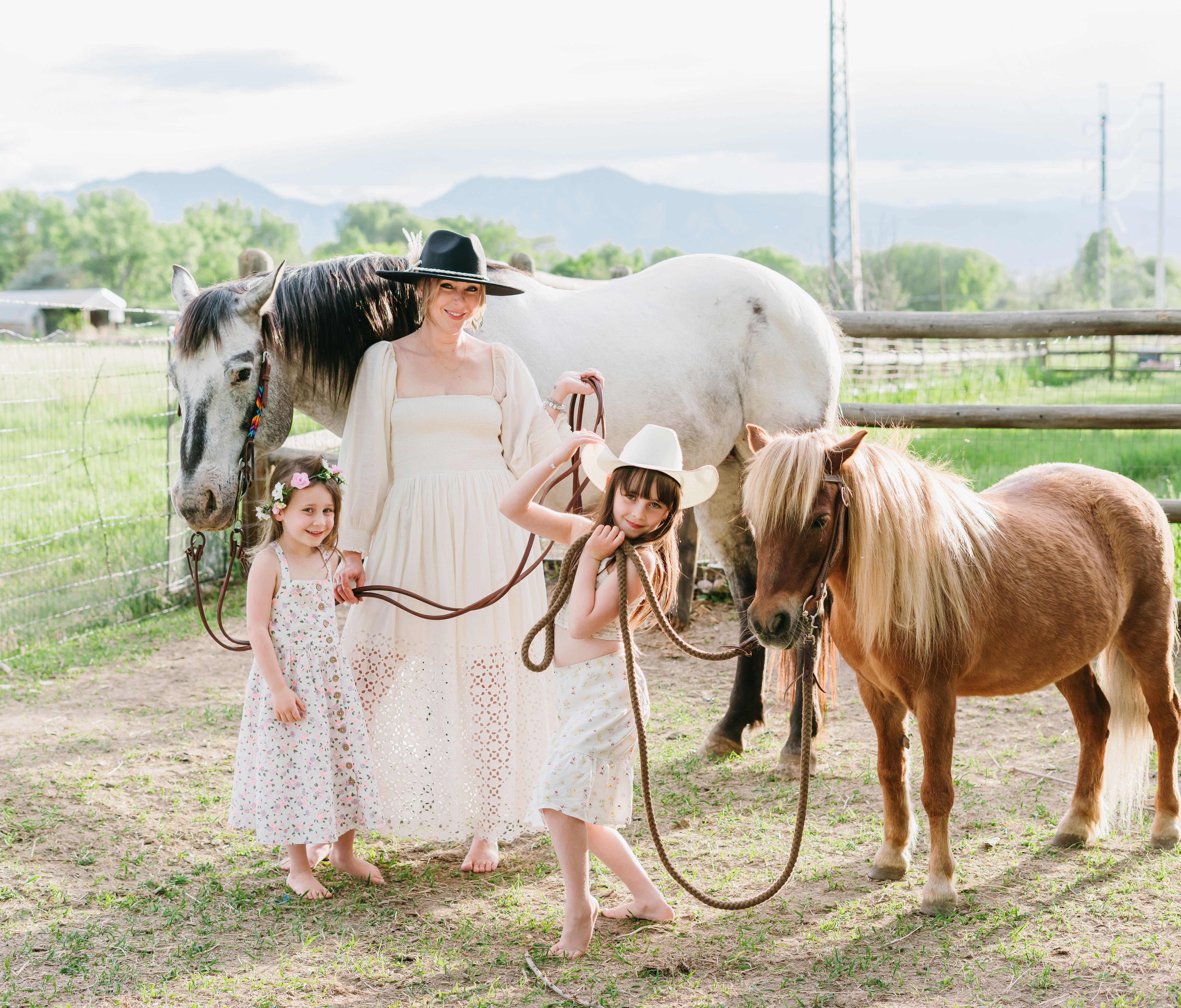 The Baron family with horses in Boulder, Colorado
